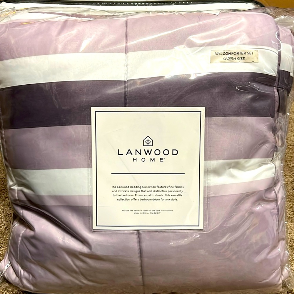 8 piece set includes Very nice set. Comforter, bed skirt, 2 shams, sheet set.